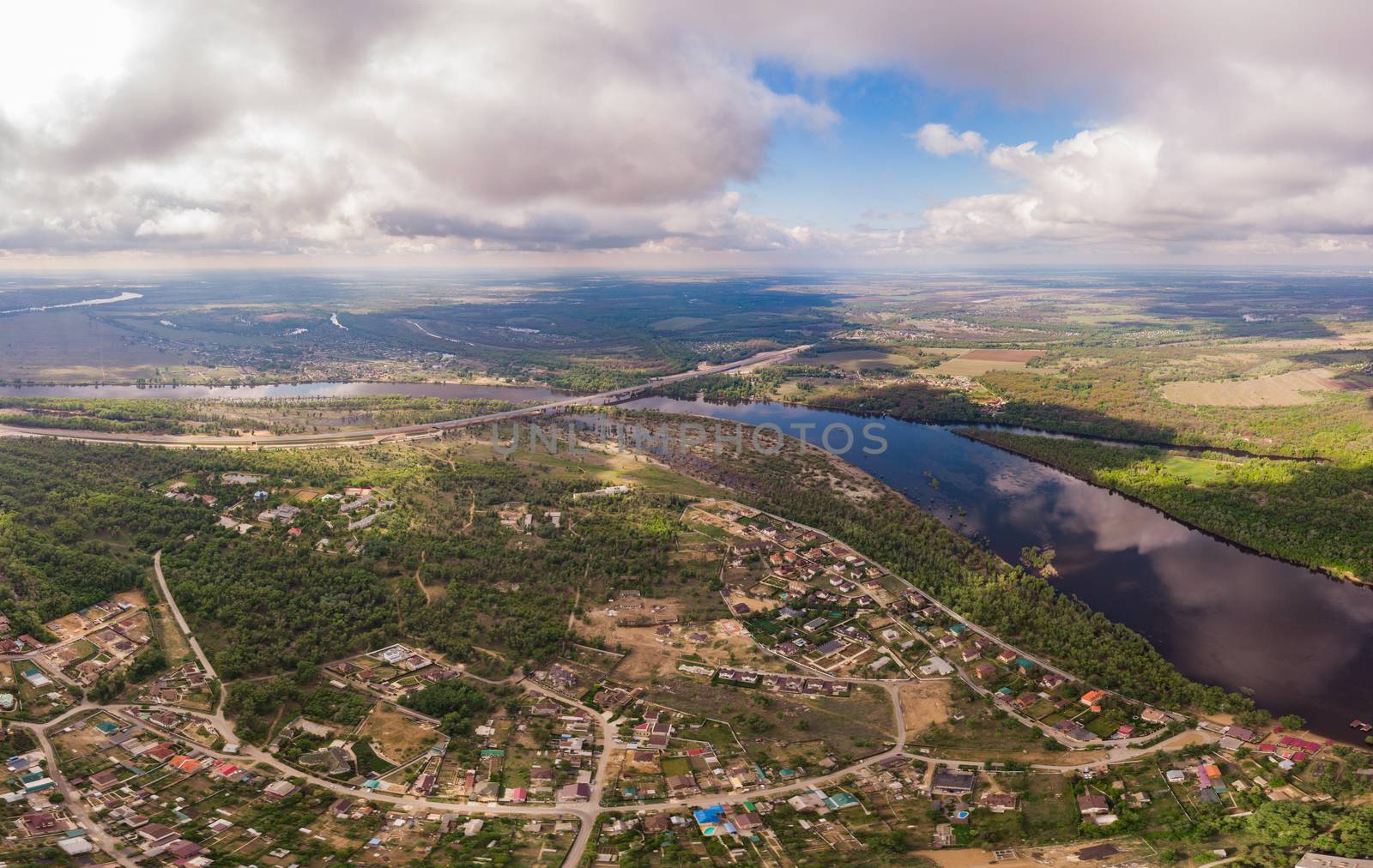 Aerial view on flowing river and town