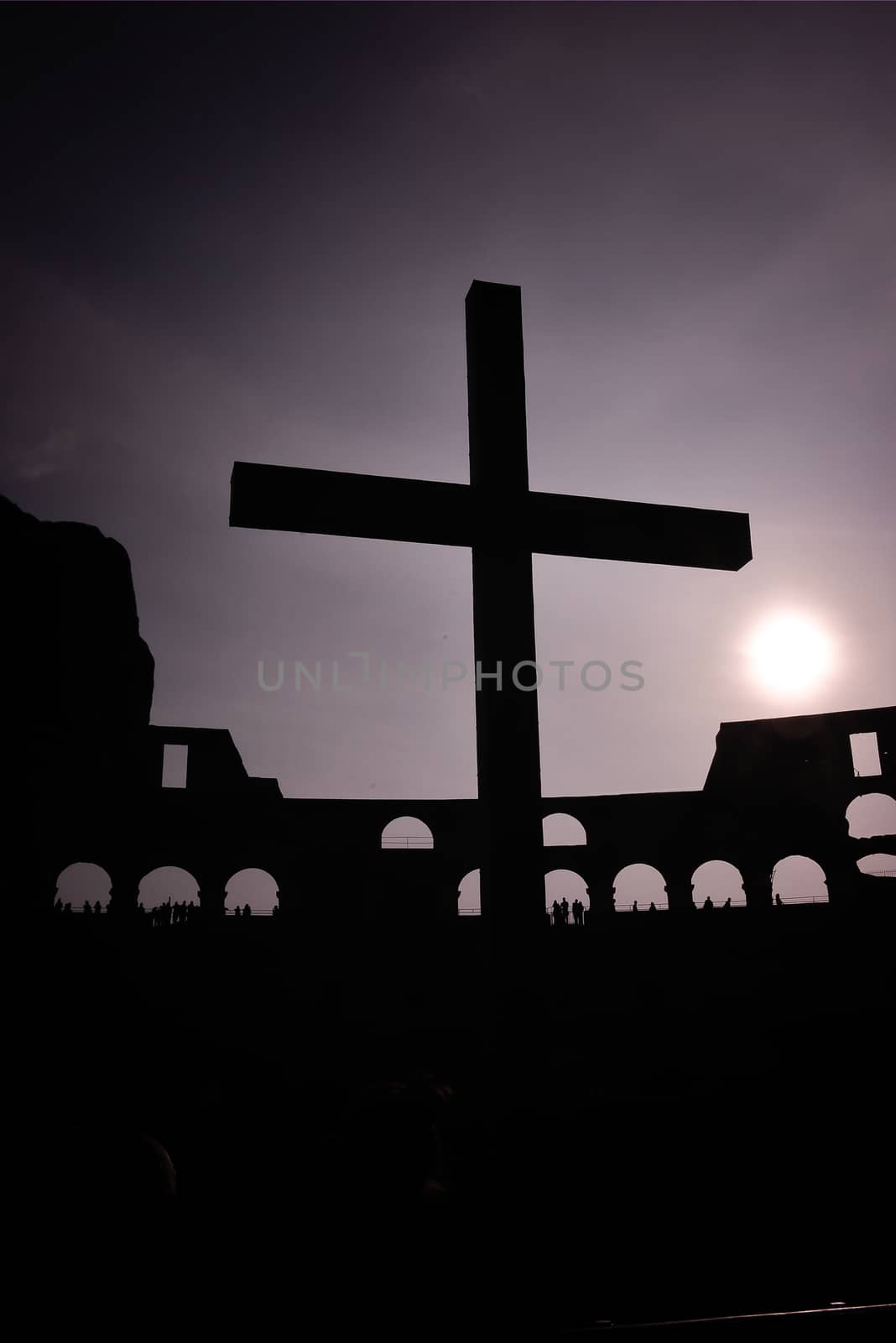 silhouette of the catalytic cross in the Coliseum. Italy