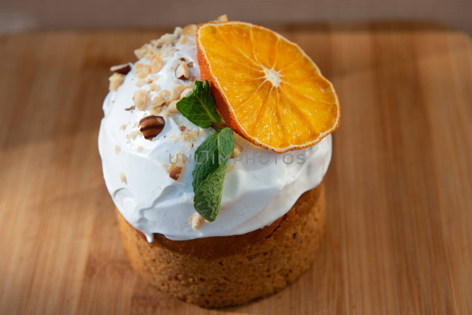 Easter, Easter cake on wooden background with a complex composition, beautiful scenery, dried fruits by marynkin