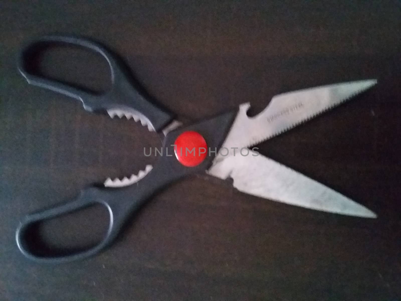 a black and red scissors