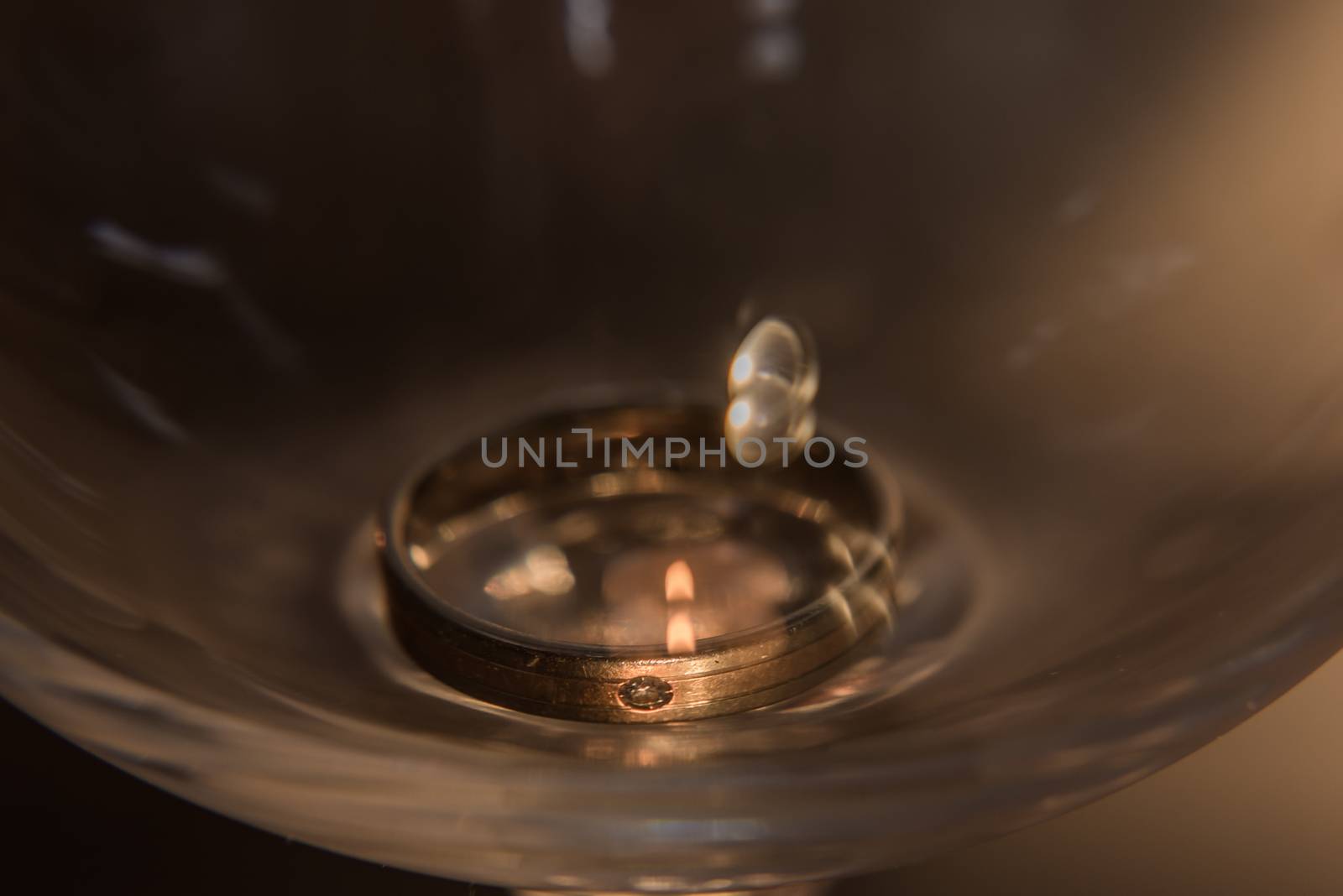 Golden wedding rings isolated on grey background. Romeo and Juliet