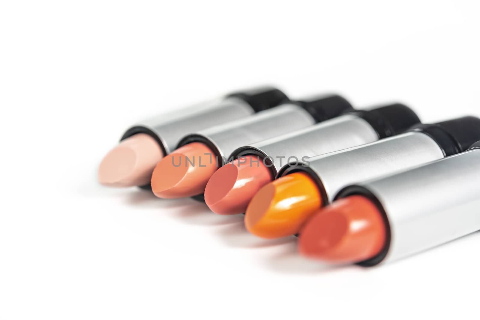 Set of colorful lipsticks on white background