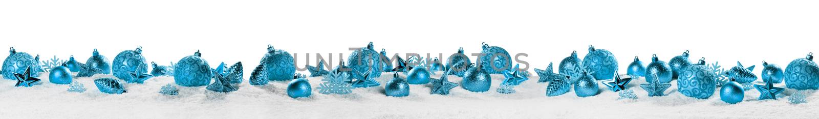 Christmas border with blue ornaments on snow isolated on white background