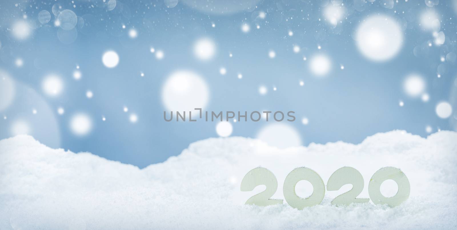 2020 New Year design concept. Wooden 2020 New Year horizontal template on snow on white bokeh backgound