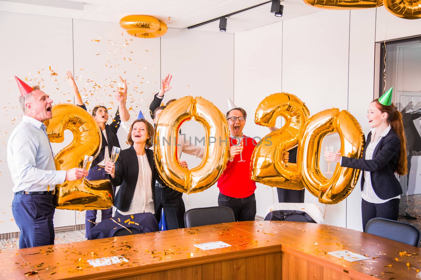 Business people celebrating 2020 New Year at office party