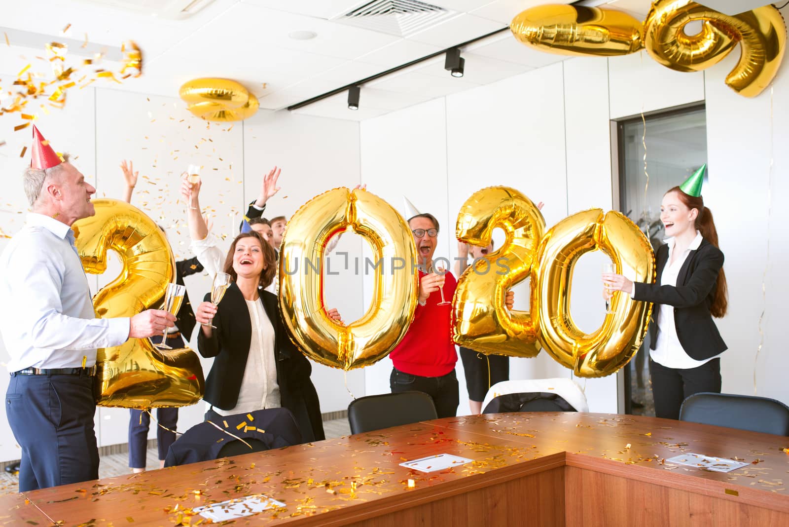 Business people celebrating 2020 New Year at office party