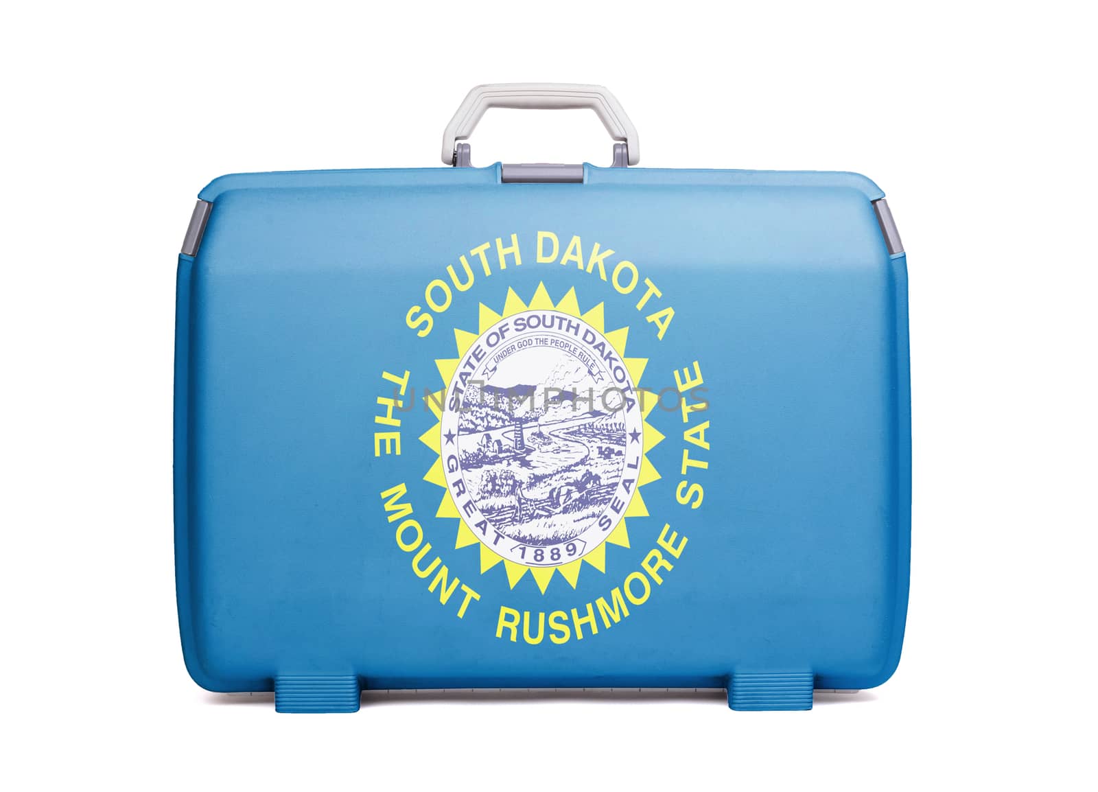Used plastic suitcase with stains and scratches, printed with flag, South Dakota