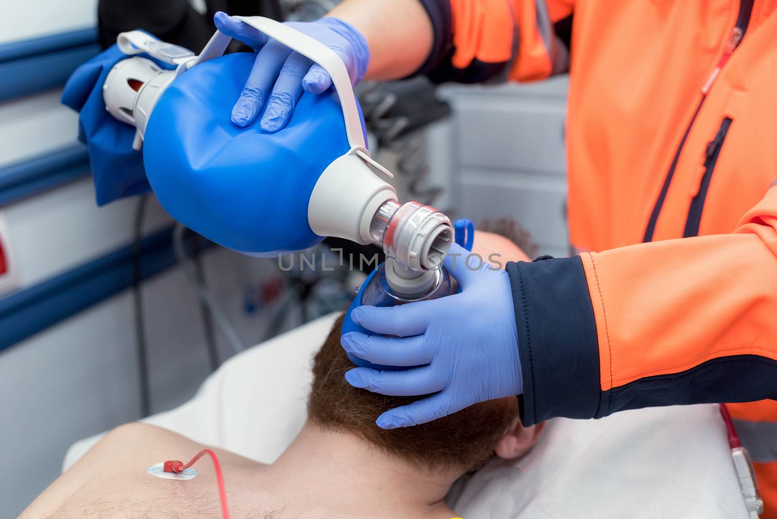 Medical urgency in the ambulance. Cardiopulmonary resuscitation using hand valve mask bag by HERRAEZ