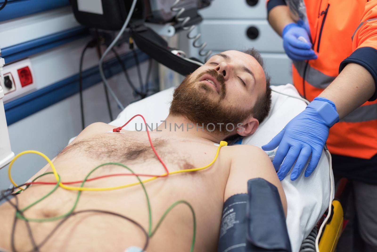 ecg electrodes on patient chest in ambulance by HERRAEZ