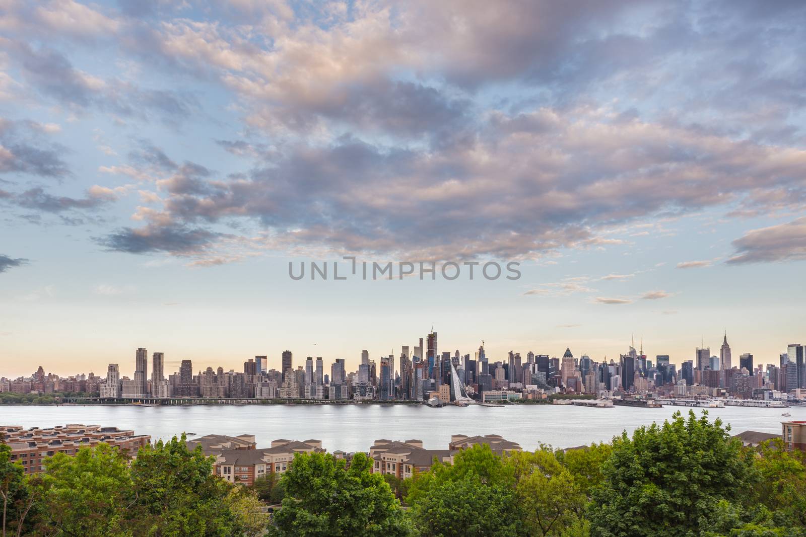 New York City midtown Manhattan skyline panorama view from Boulevard East Old Glory Park over Hudson River.