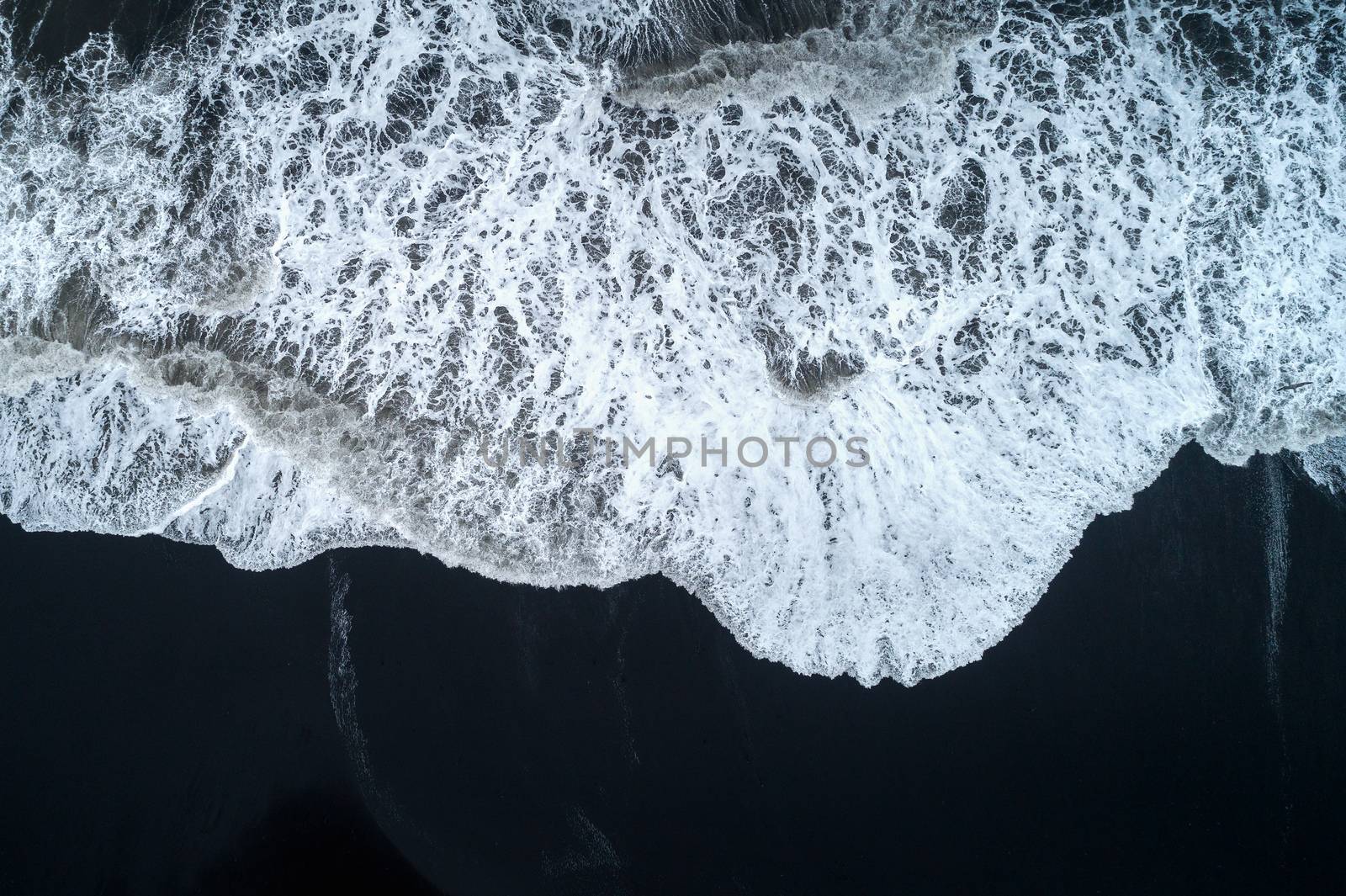 Aerial view of Black sand beach and ocean waves in Iceland. by gutarphotoghaphy