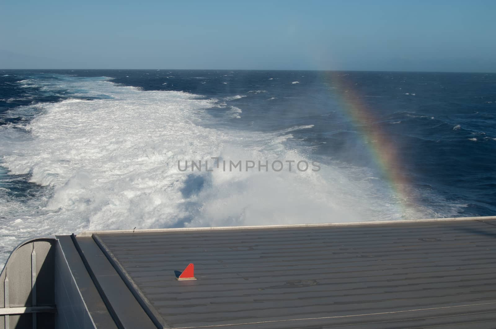 Back of a ship, wake and rainbow. by VictorSuarez