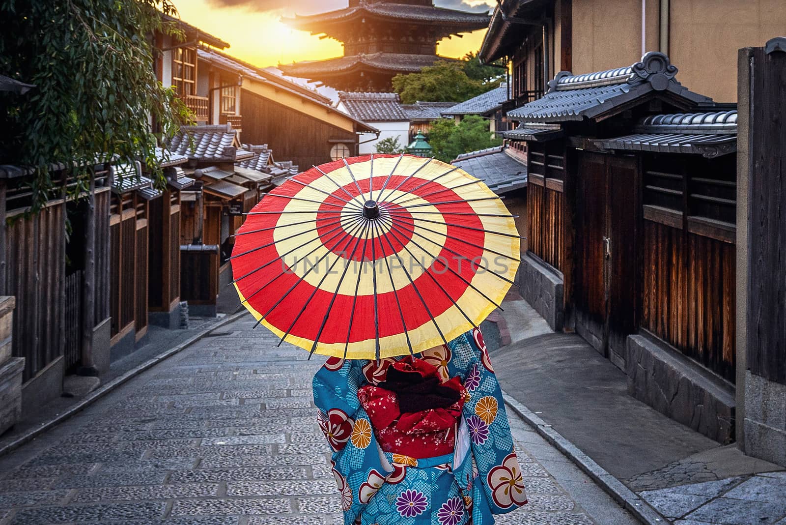 woman wearing japanese traditional kimono with umbrella at Yasaka Pagoda and Sannen Zaka Street in Kyoto, Japan. by gutarphotoghaphy