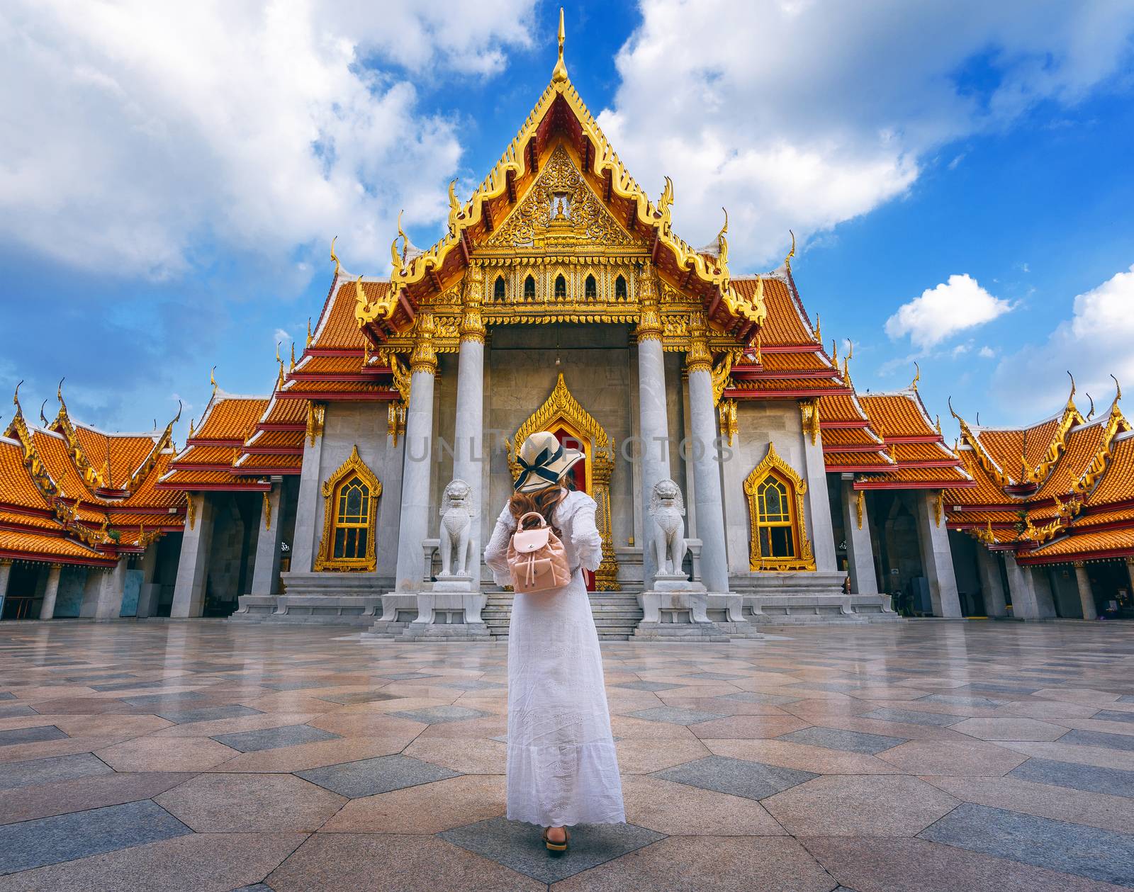 Women tourists at Wat Benchamabophit or the Marble Temple in Bangkok, Thailand. by gutarphotoghaphy