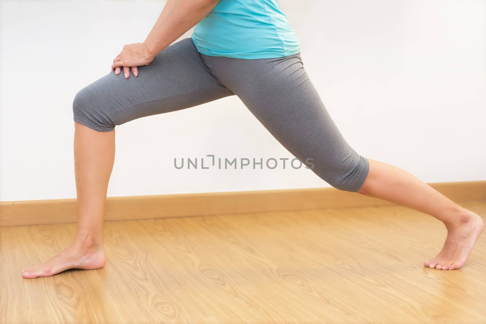 Close up of young woman practicing Yoga. by HERRAEZ