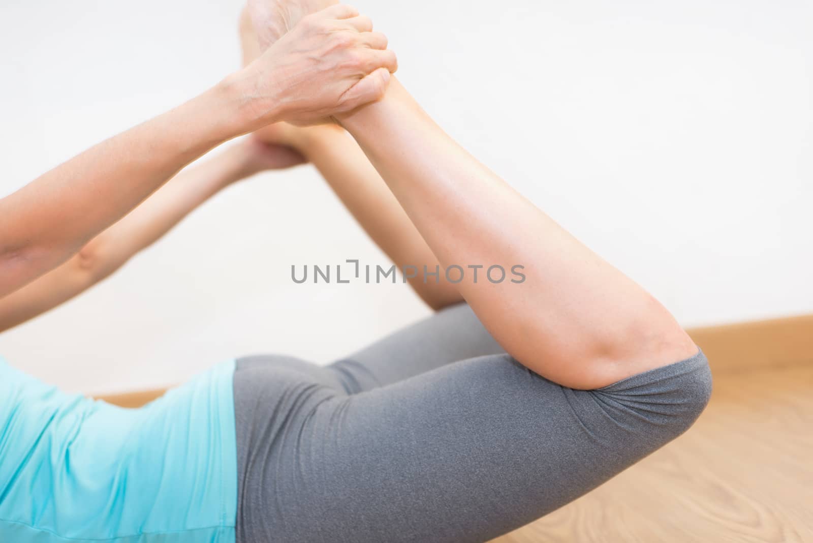 Close up of young woman practicing Yoga. by HERRAEZ