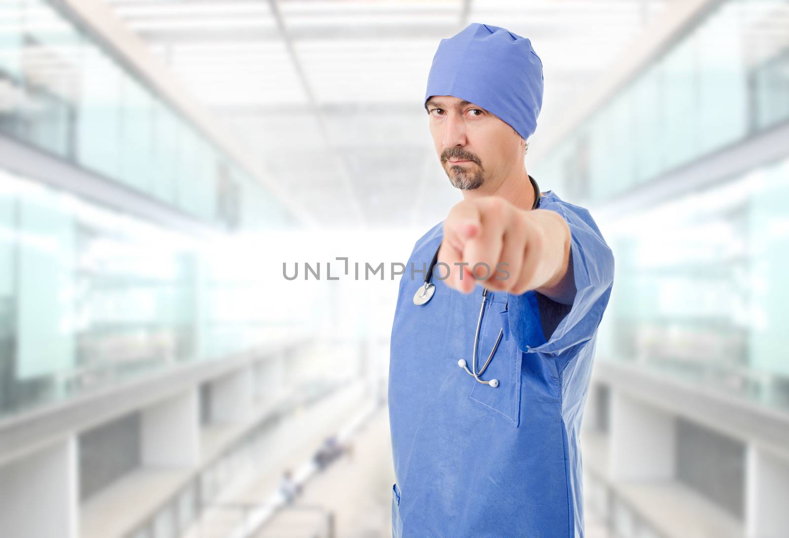 male doctor pointing at the hospital