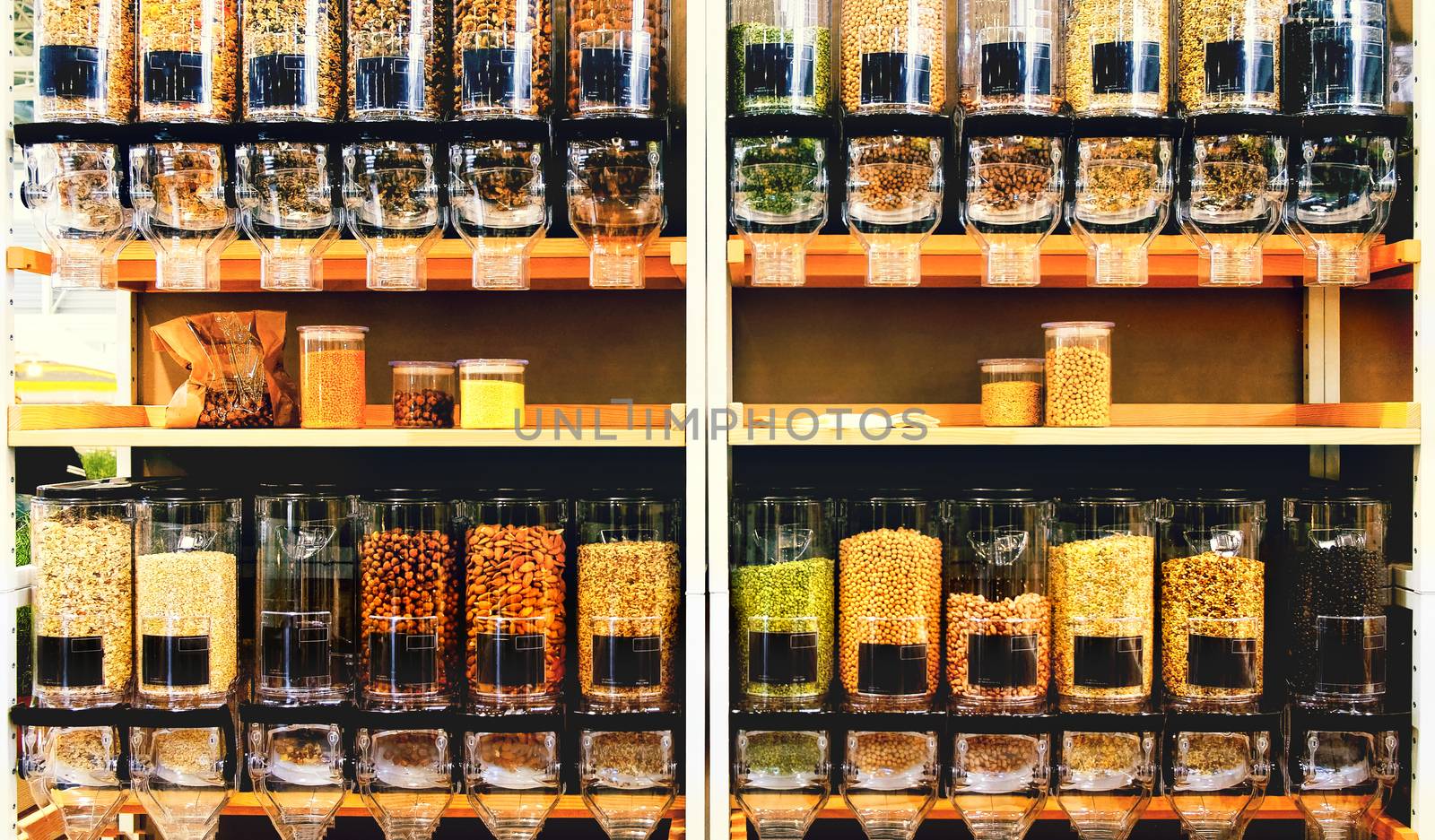 bulk food store texture dispenser bins on shelves in a sustainable zero waste eco friendly shop market