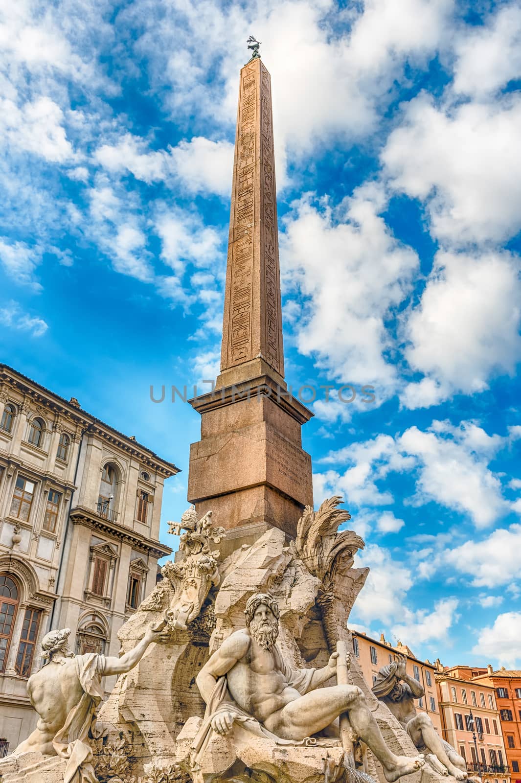 Obelisk and Fountain of the Four Rivers, iconic landmark designed in 1651 by Bernini, located in the famous Piazza Navona, Rome, Italy
