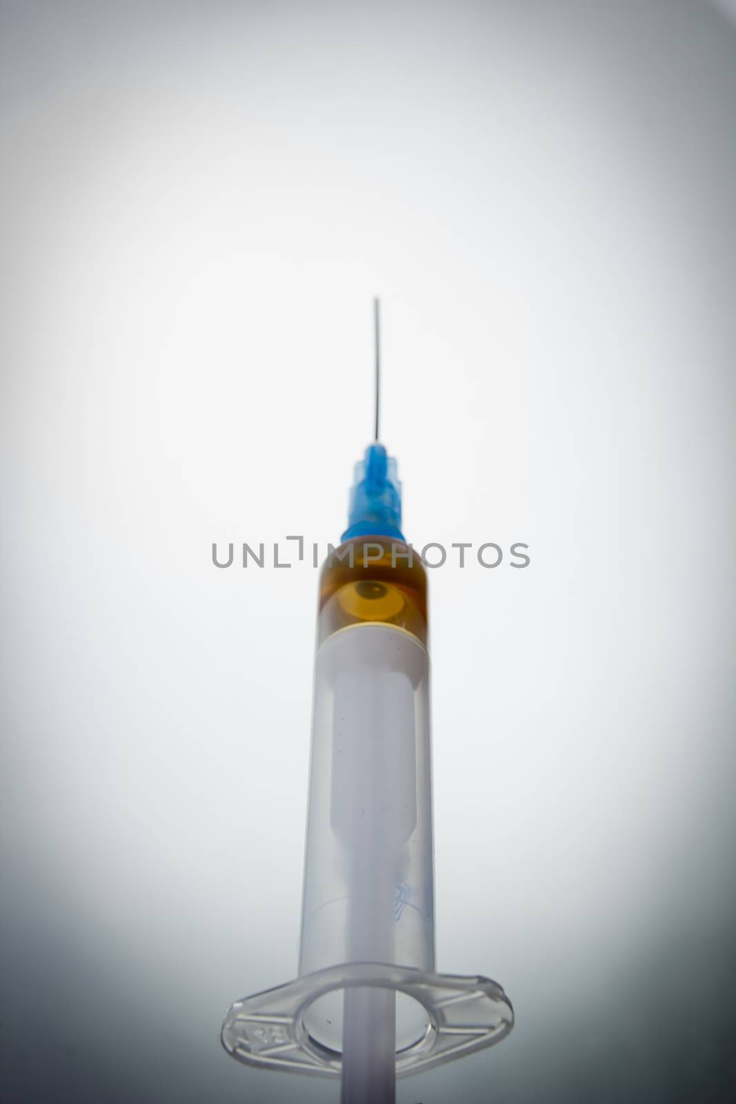 Medical hypodermic needle on a white background