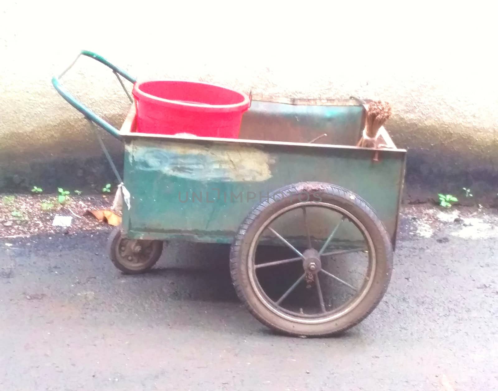 a steel garden cart with supplies