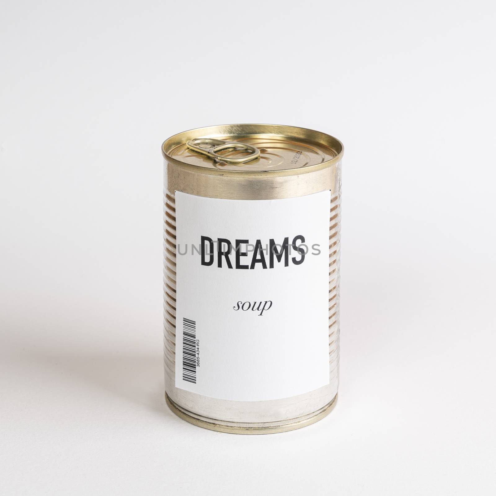 a jar containing dreams soup on a white surface