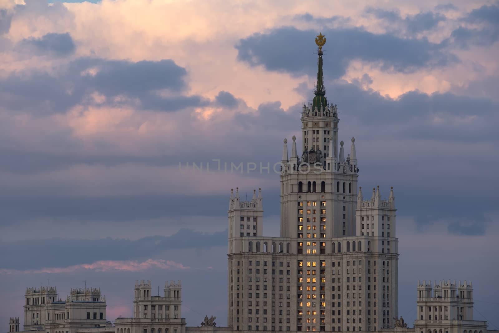  Moscow Russia on against dramatic sunset sky. Building of Stalin's era.
