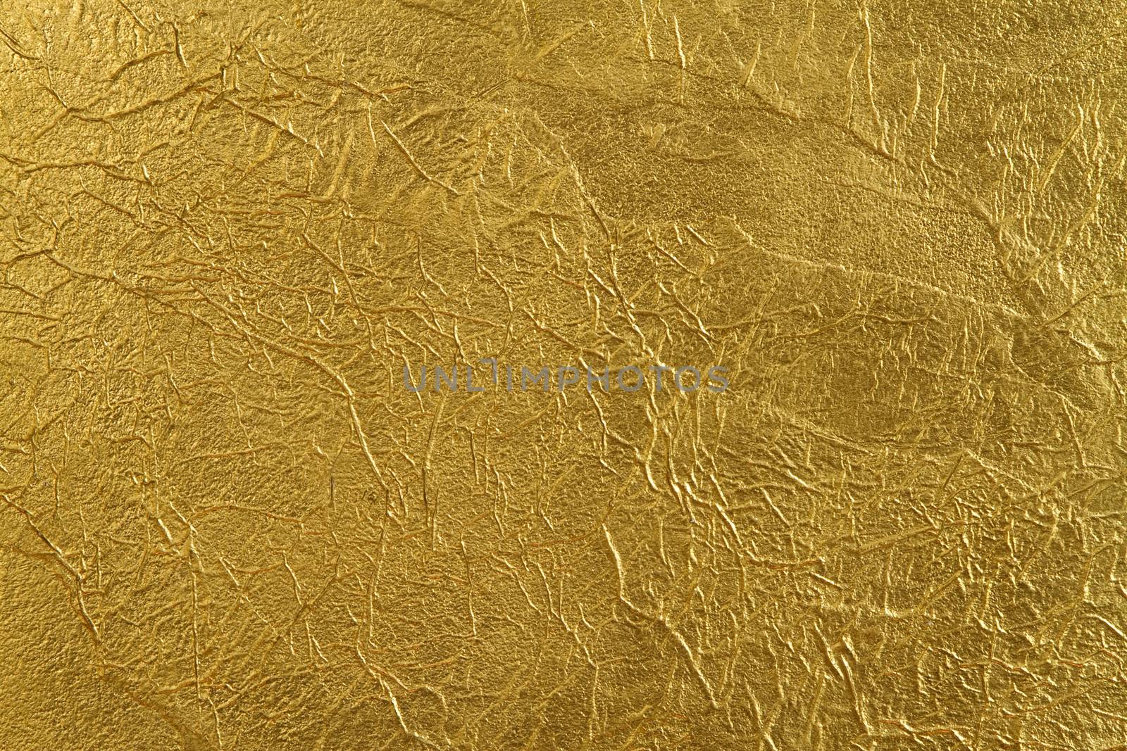 texture of the wall, covered with a thin gold foil, with beautiful folds and fissures