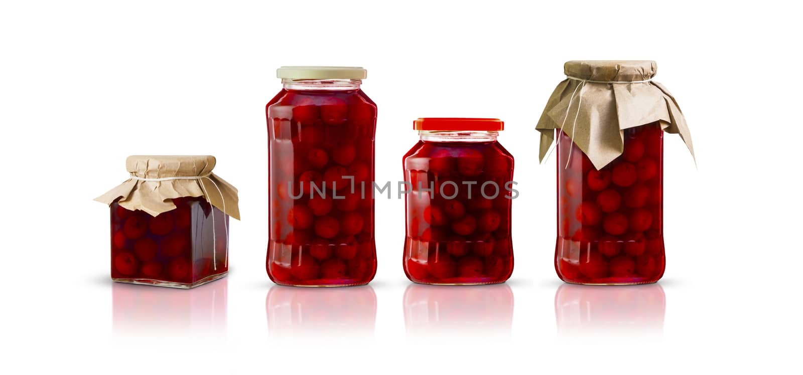 Cherry compote in glass jars of different shapes. Isolated on white background. With clipping path