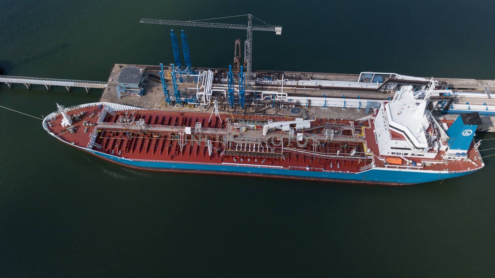 ship going in to Harbor Ventspils Latvia Aerial view of countryside drone top view