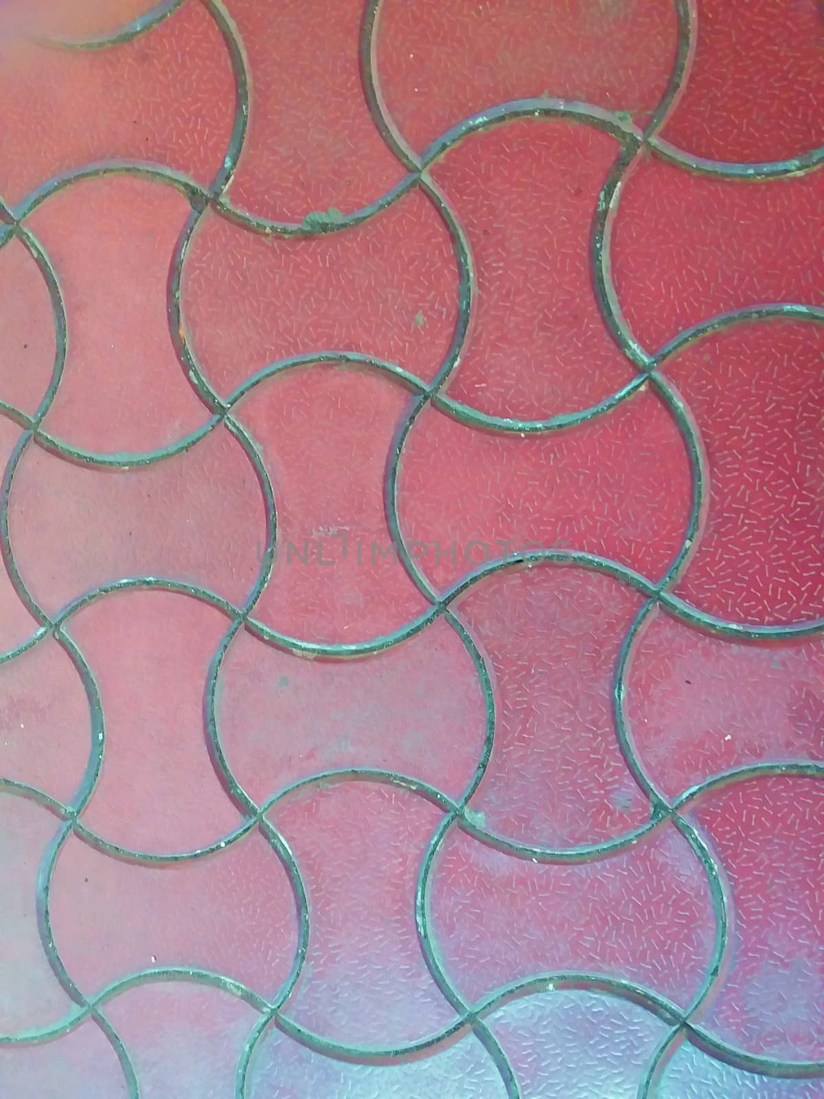 red ceramic design on floor tiles