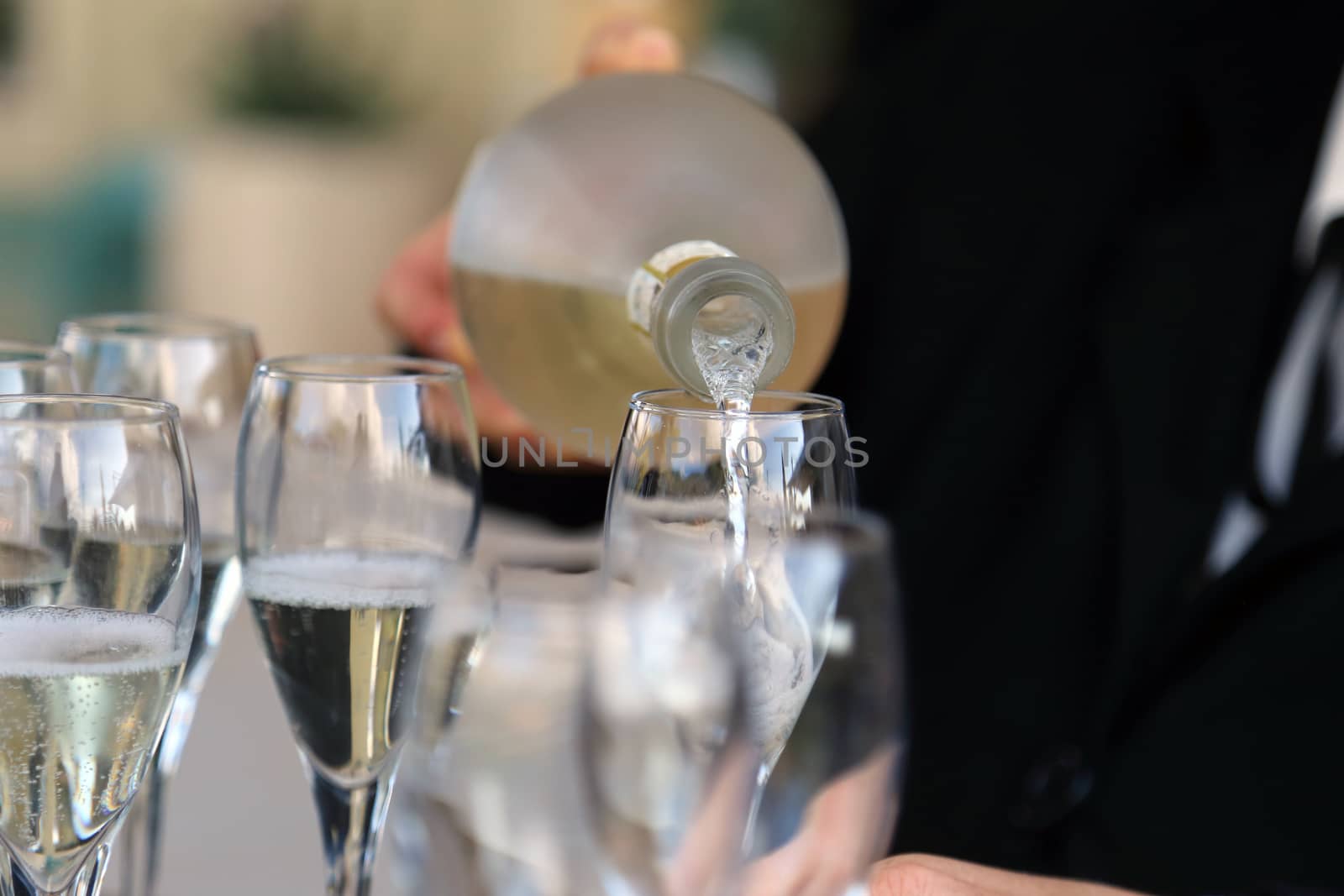 Glass glasses with prosecco - setting up the glasses on the table in the restaurant for an aperitif