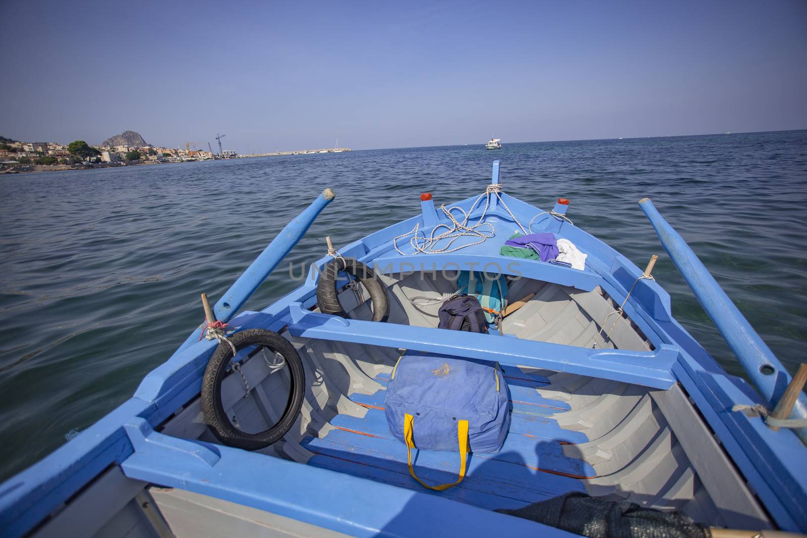 Blue Rowboat in transaparent sea of Sicily