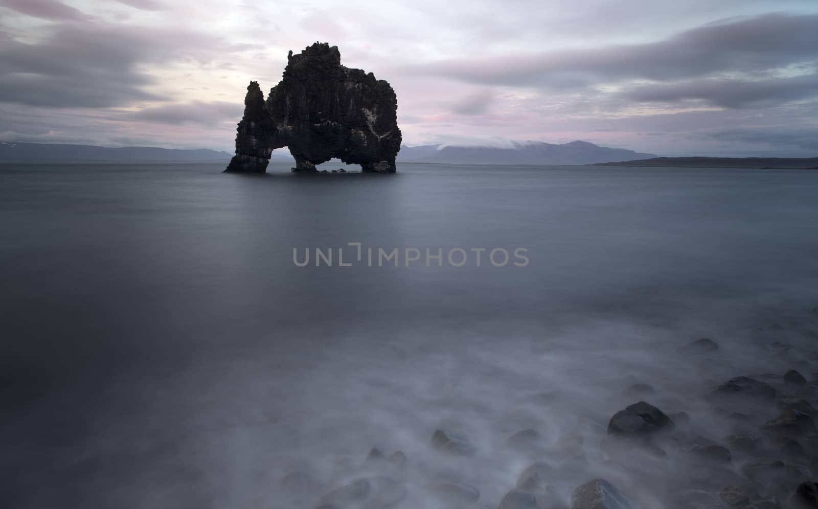 Rocky seashore of the Atlantic ocean in stormy weather, Iceland.