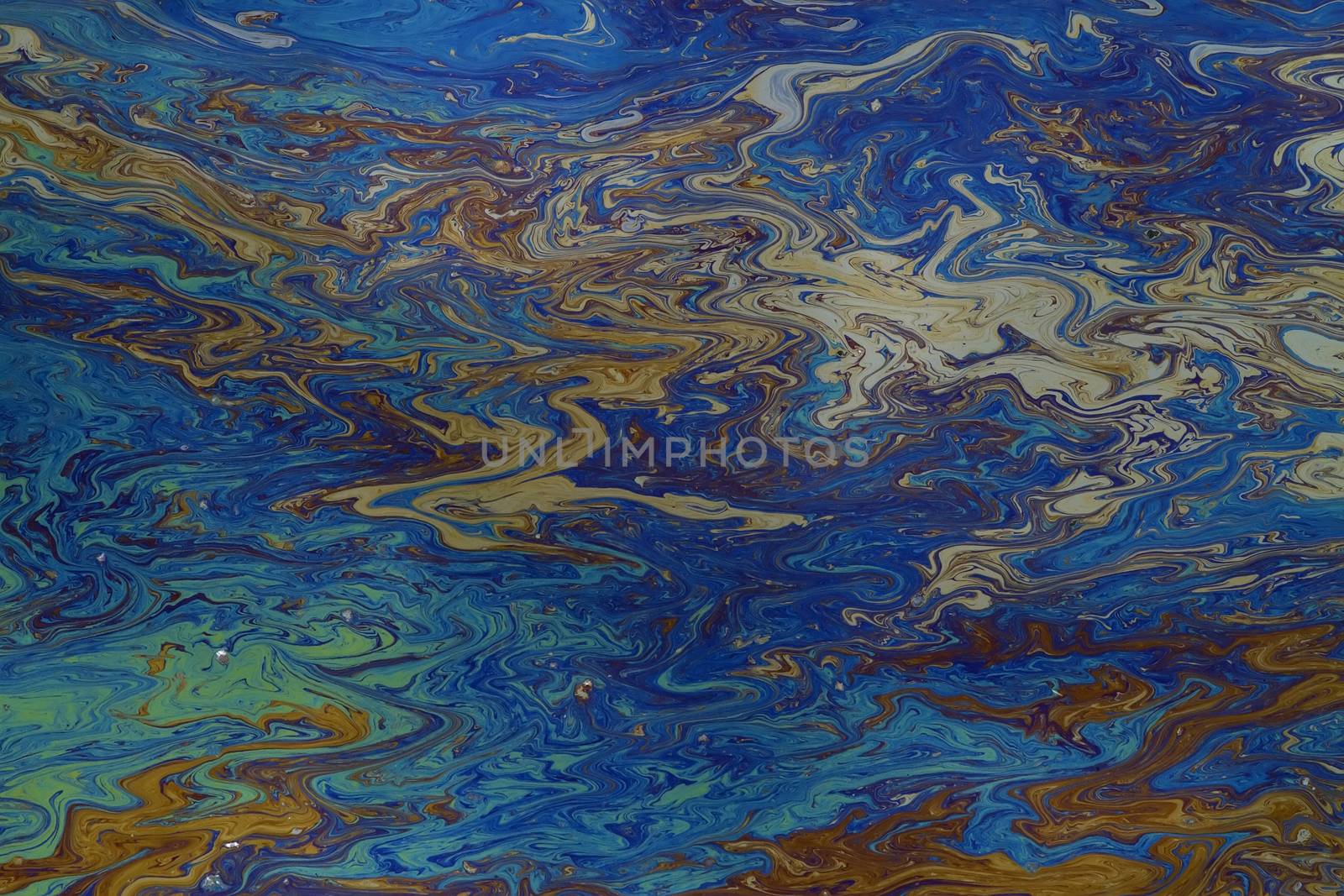background of an oil slick on water showing the brilliant colors