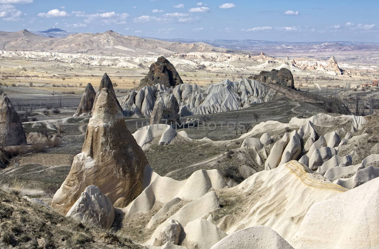strange mountain valley, tuff stone formations in cappadocia, turkey.