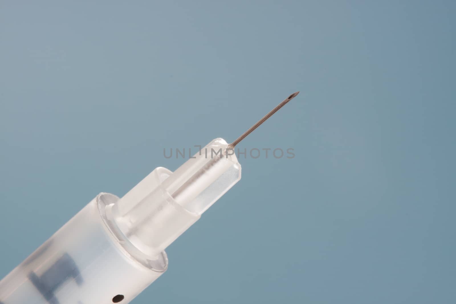 Closeup on medical subcutaneous needle shot for insulin or other drugs