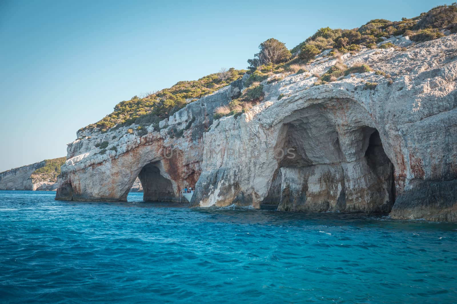 Blue caves on Zakynthos island, Greece .Famous caves with crystal clear waters on Zakynthos island - Blue sky.