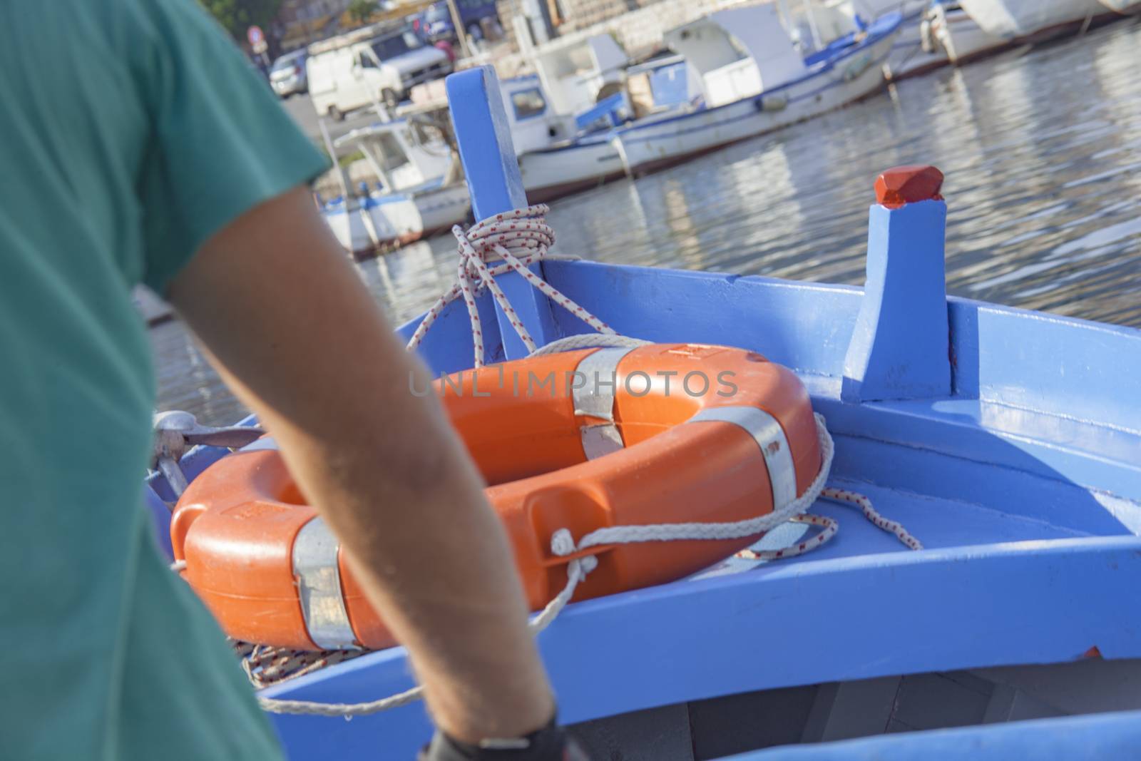 Rowing boat detail with life buoy.