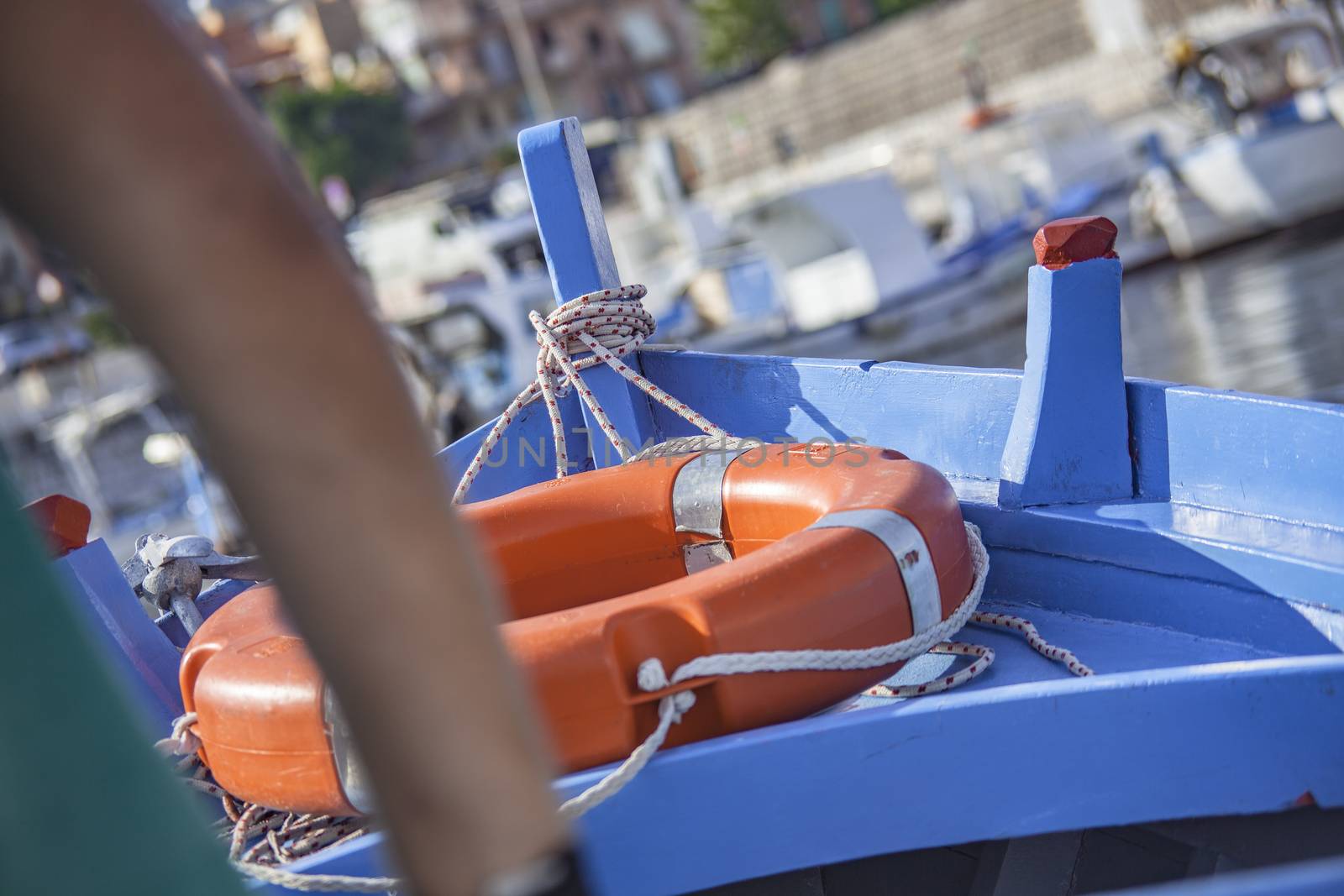 Rowing boat detail with life buoy.