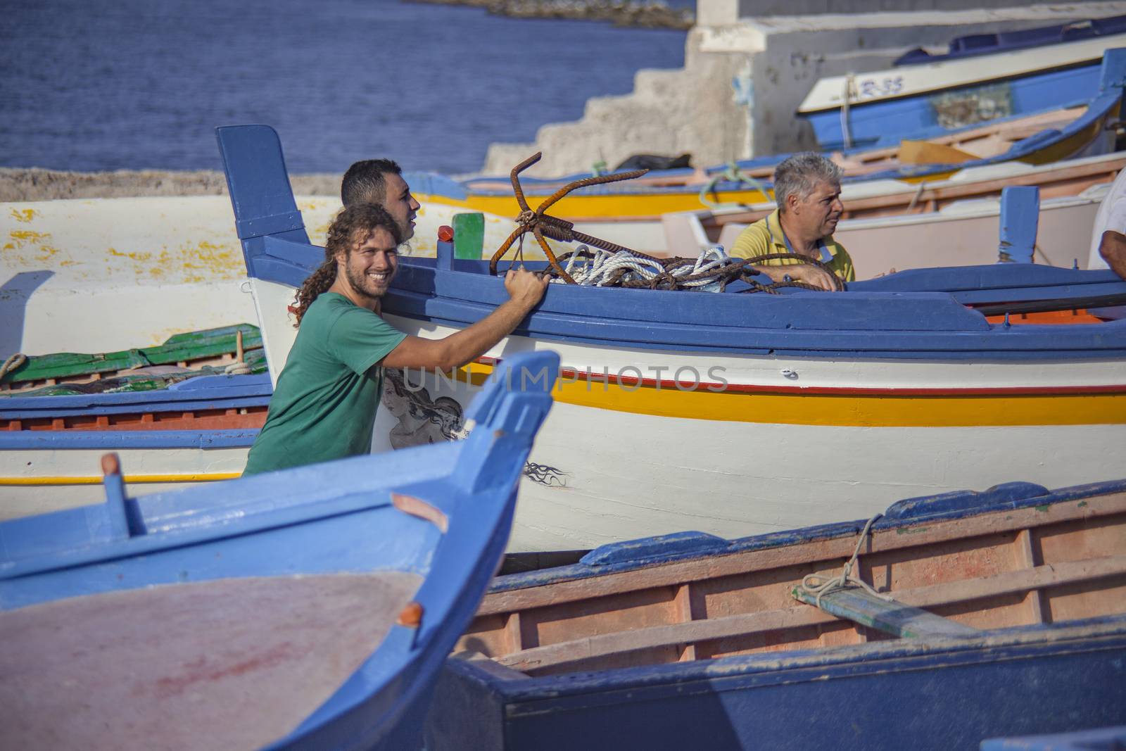 Men drag boat in Sicily