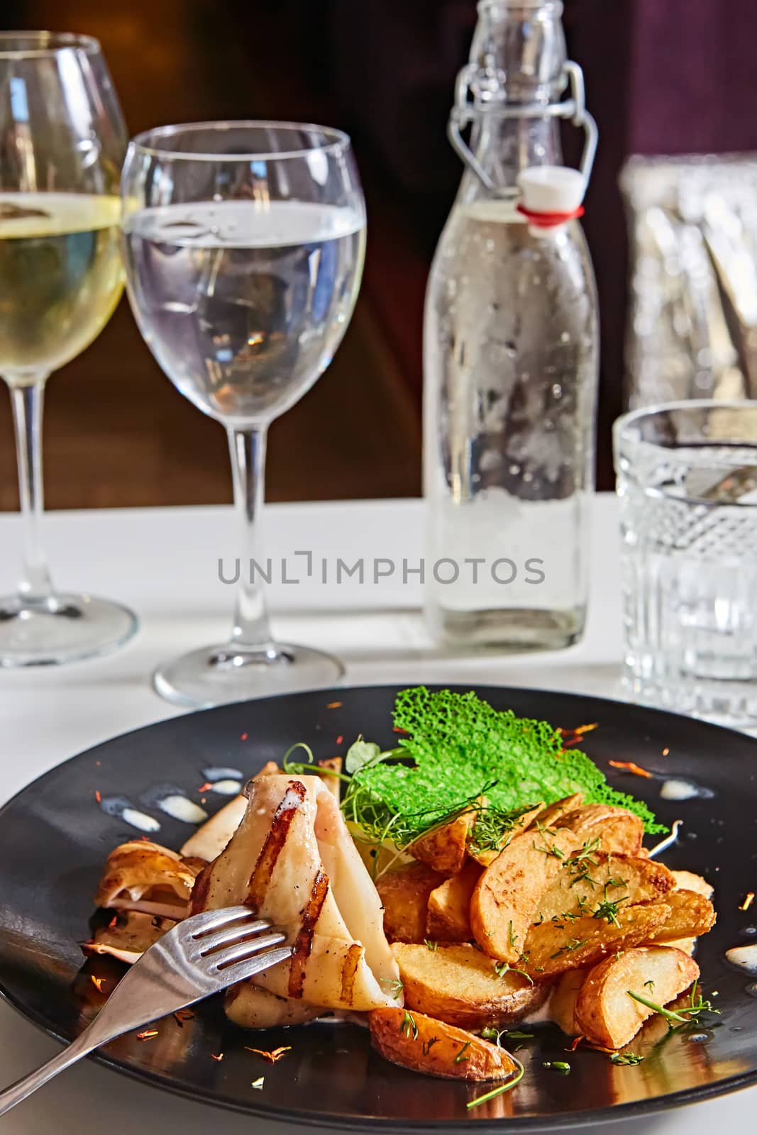 Grilled squid with salad. Shallow dof