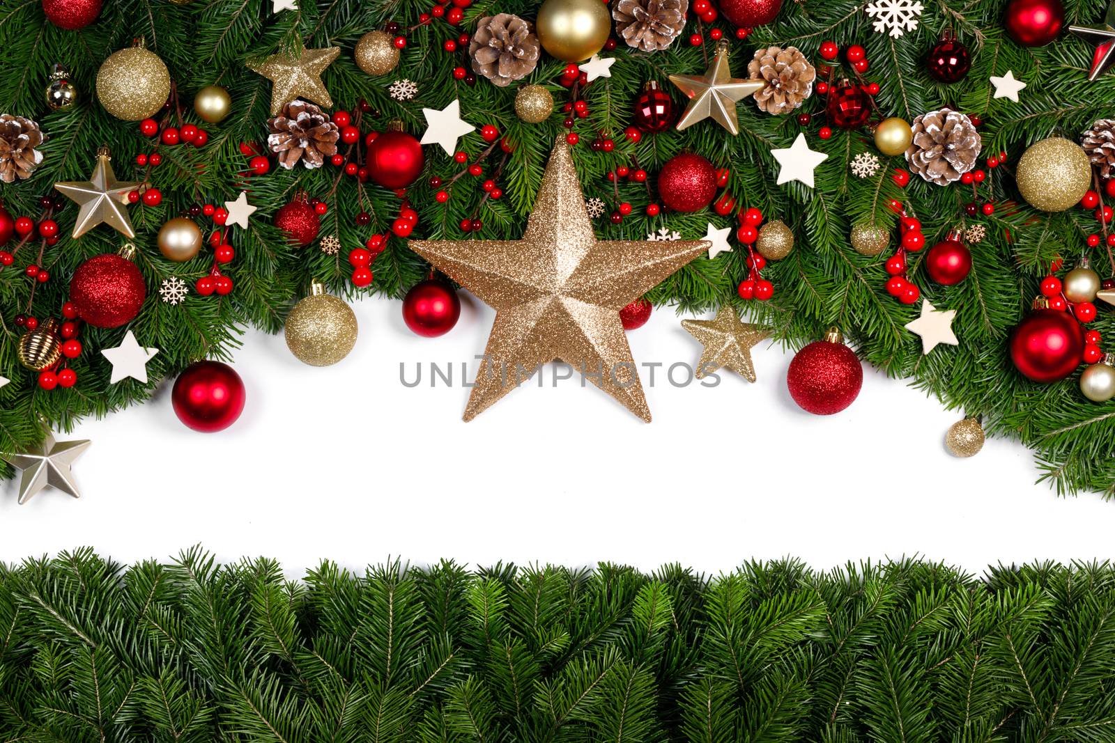 Christmas Border frame of tree branches around white background with copy space isolated, red and golden decor, berries, stars, cones