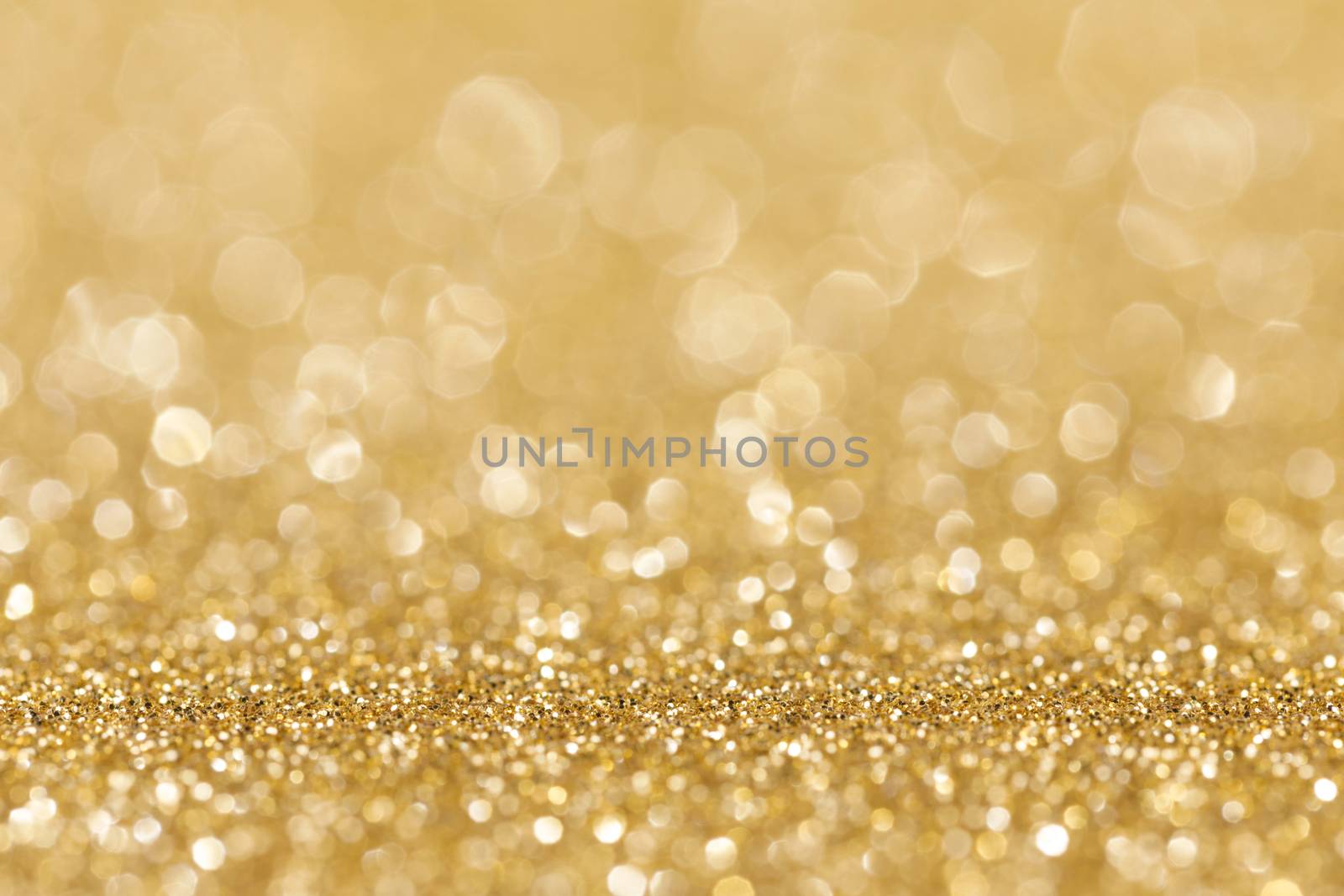 Shiny golden bokeh glitter lights abstract background, Christmas New Year party celebration concept