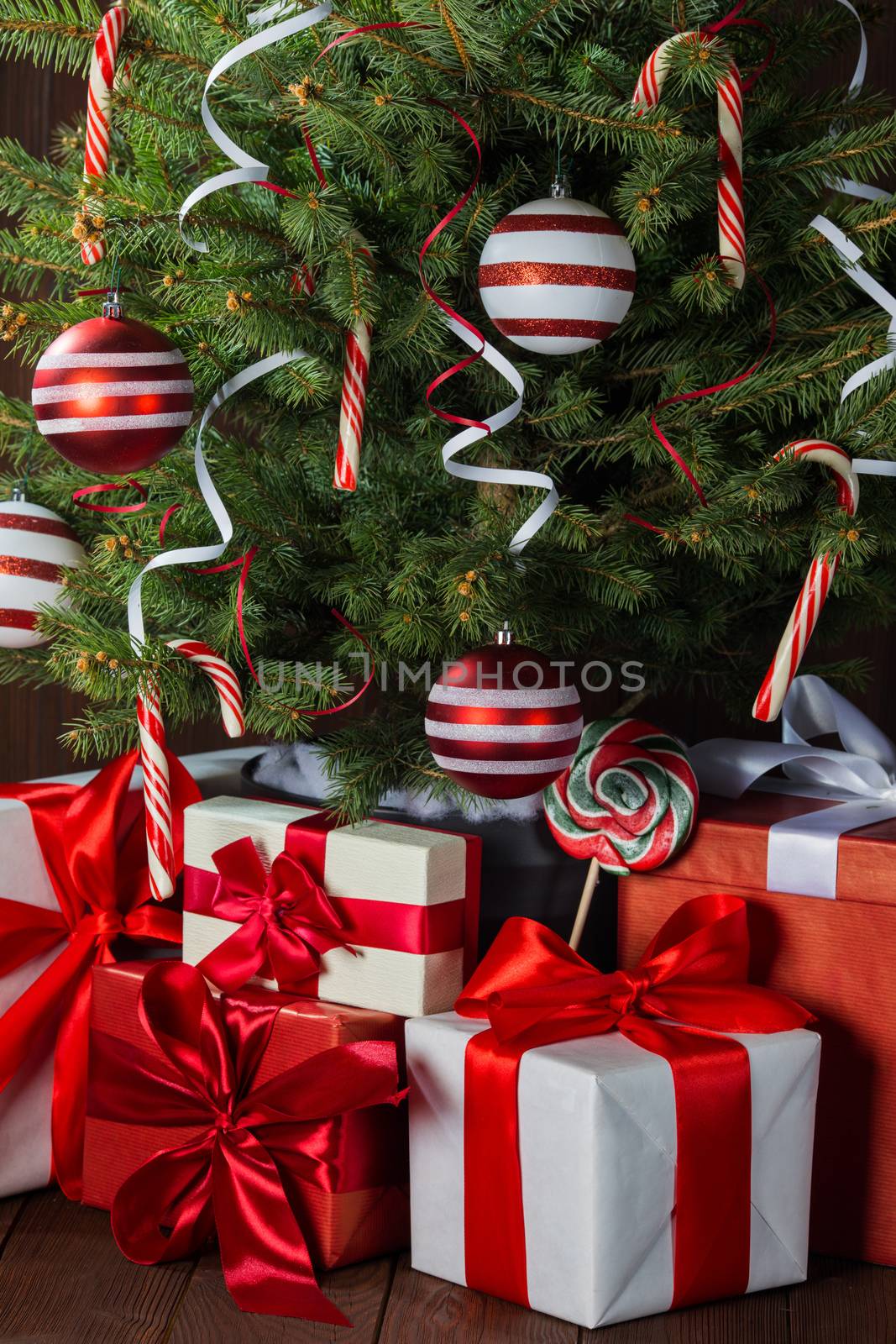 Decorated Christmas tree and gift boxes background