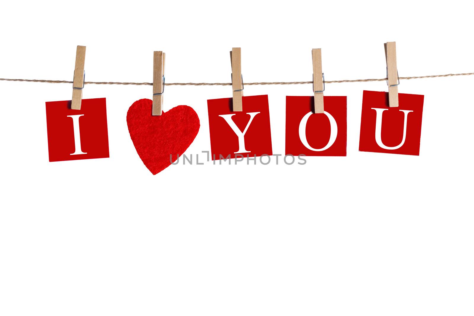 Clothes pegs and I LOVE YOU words on papers on rope isolated on white background Valentines day concept