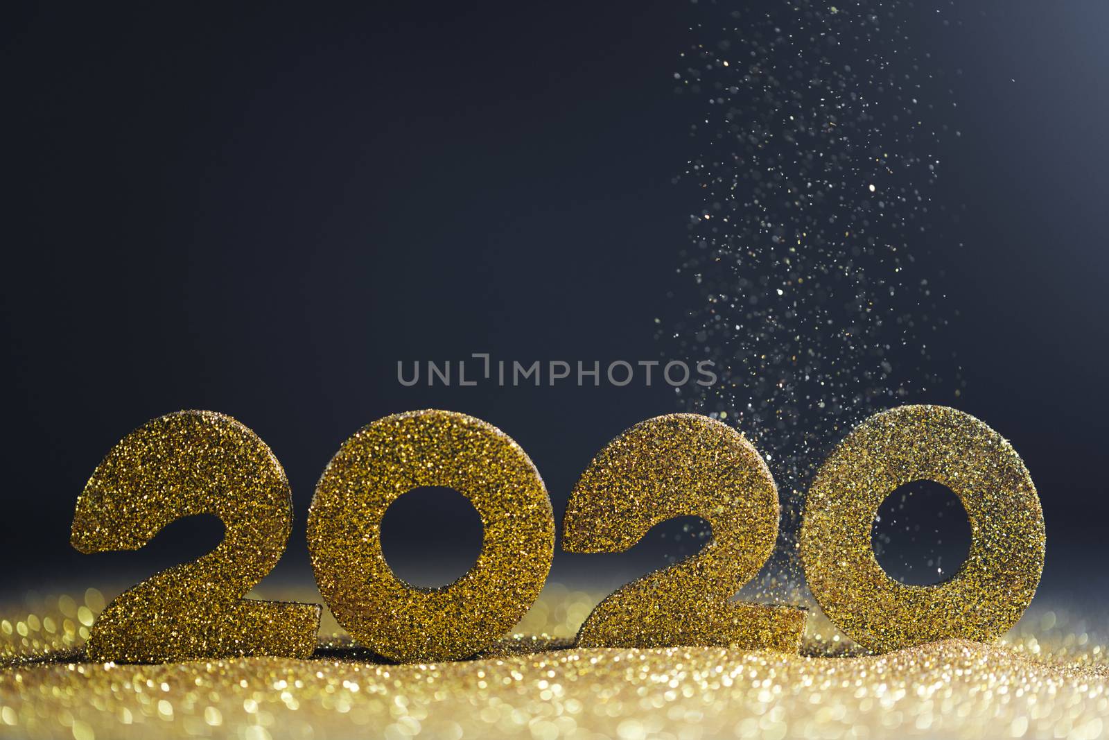 2020 New Year luxury design concept. Golden 2020 New Year horizontal template with golden glitter on blue backgound