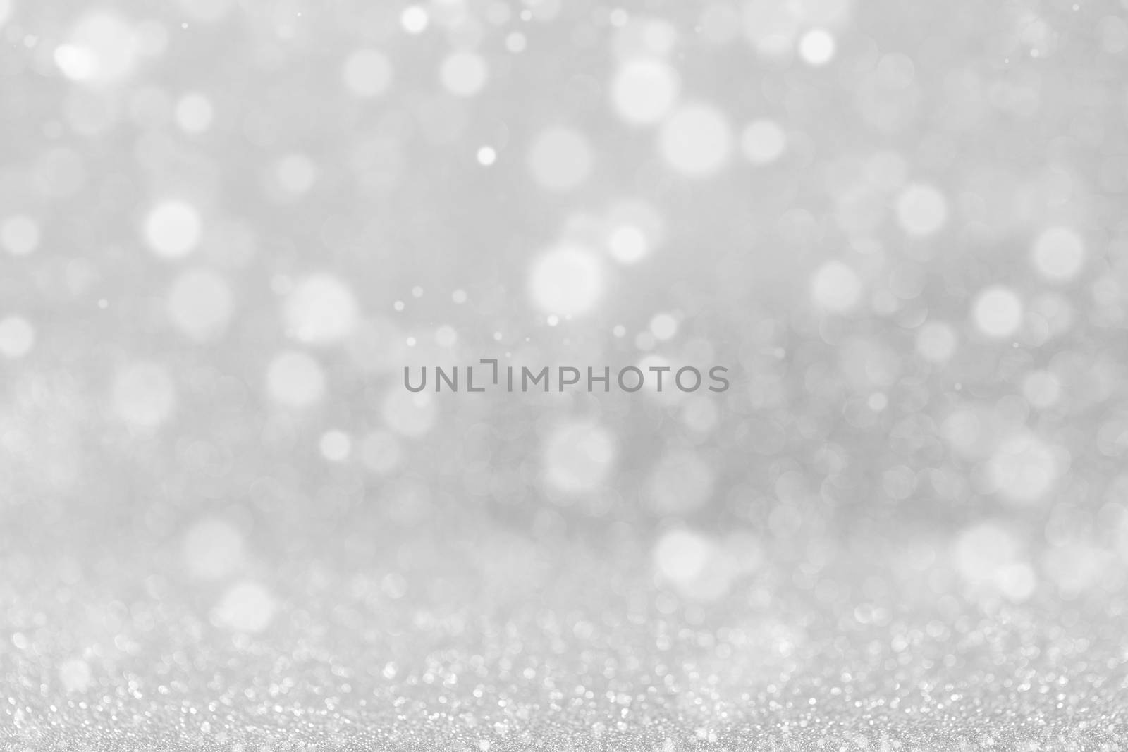 Shiny silver bokeh glitter lights abstract background, Christmas New Year party celebration concept