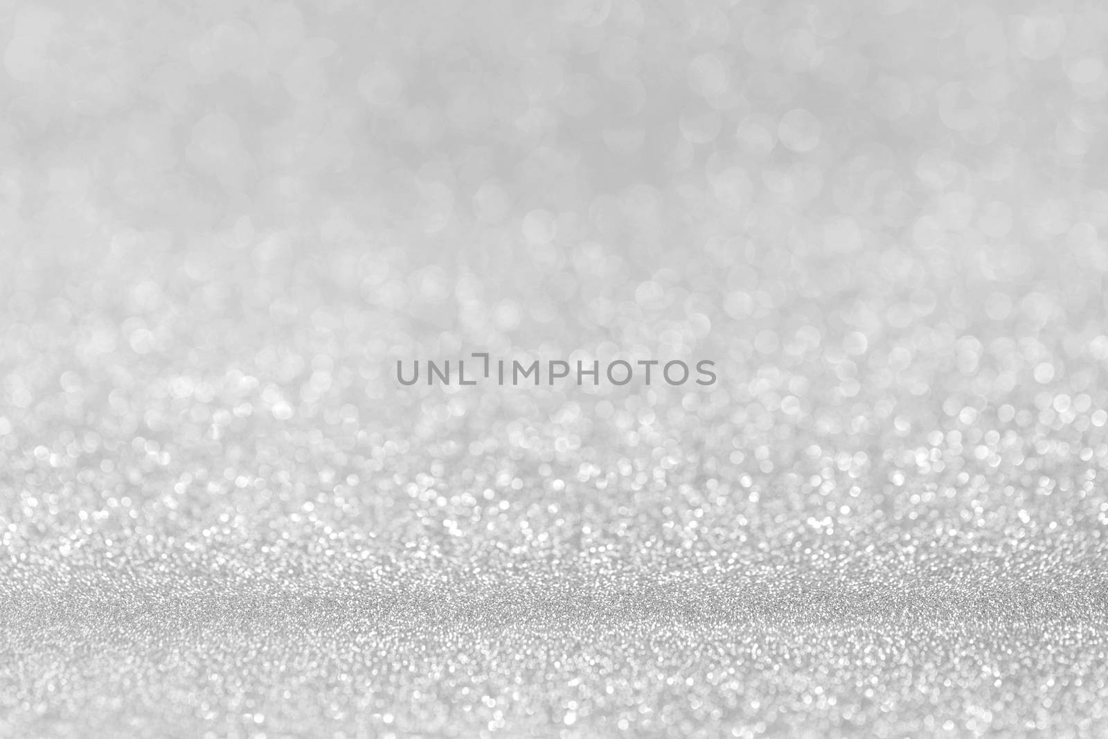 Shiny silver bokeh glitter lights abstract background, Christmas New Year party celebration concept