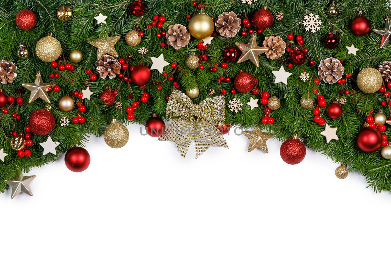 Christmas Border frame of tree branches on white background with copy space isolated, red and golden decor, berries, stars